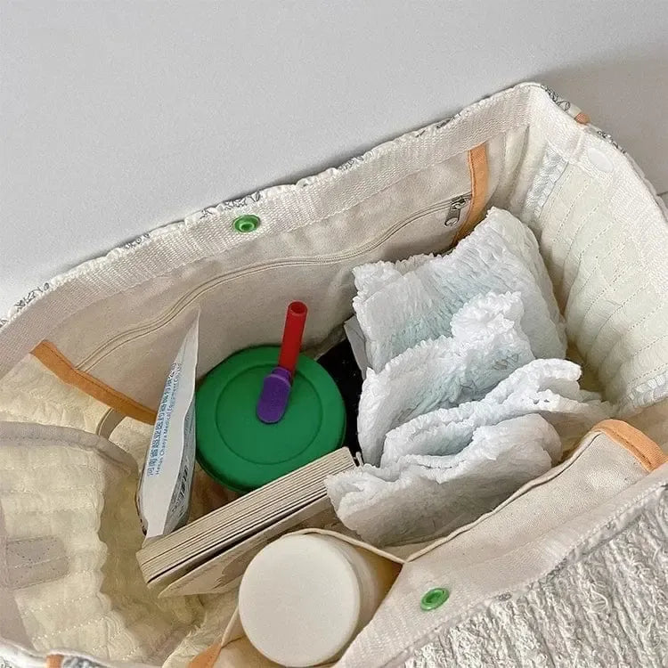 Sac à langer matelassé à pompon Émeraude